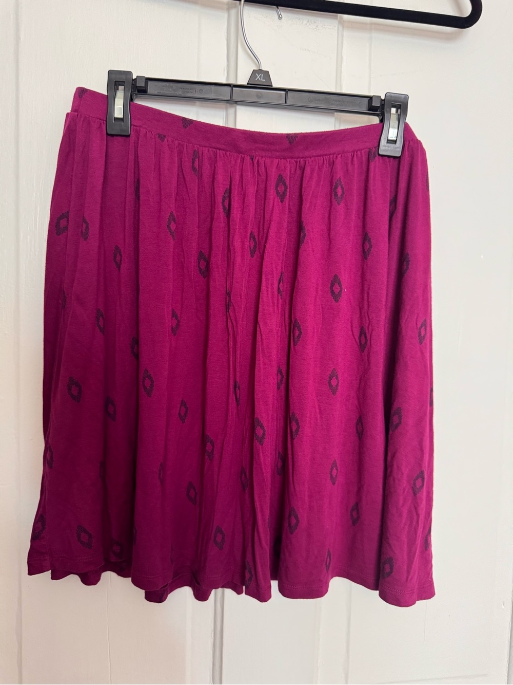 Berry mini skirt with navy tribal design